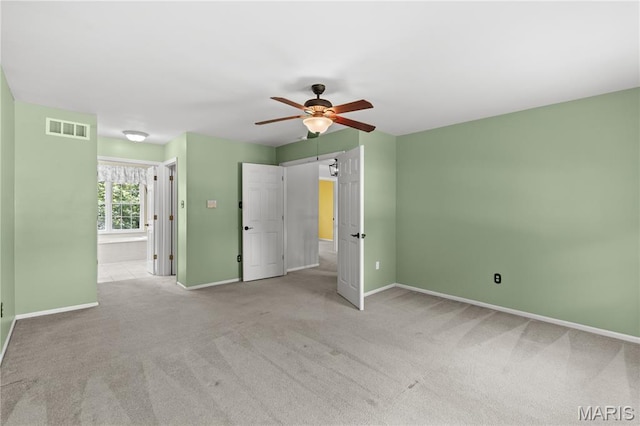 16112 Ridgewoods Manor Cir, Ellisville, MO 63038 - unfurnished bedroom featuring baseboards, carpet floors, ceiling fan, and connected bathroom