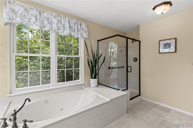 16112 Ridgewoods Manor Cir, Ellisville, MO 63038 - bathroom with plenty of natural light, a whirlpool tub, and a stall shower