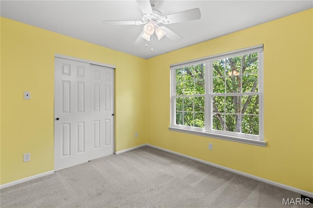 16112 Ridgewoods Manor Cir, Ellisville, MO 63038 - unfurnished bedroom featuring carpet floors, baseboards, a closet, and ceiling fan