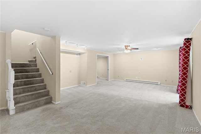 16112 Ridgewoods Manor Cir, Ellisville, MO 63038 - unfurnished living room featuring a baseboard heating unit, ceiling fan, carpet floors, and stairs