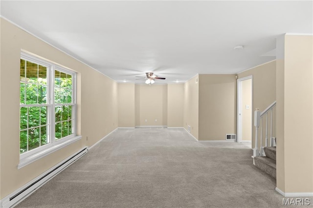 16112 Ridgewoods Manor Cir, Ellisville, MO 63038 - unfurnished room featuring a baseboard radiator, a ceiling fan, light colored carpet, stairs, and baseboards