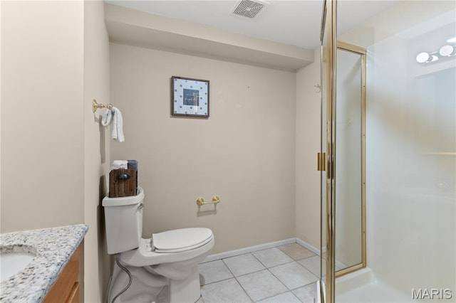 16112 Ridgewoods Manor Cir, Ellisville, MO 63038 - bathroom featuring vanity, a stall shower, tile patterned flooring, toilet, and baseboards