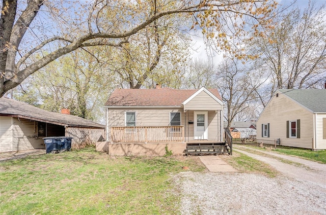 1810 N Van Buren St, Litchfield, IL 62056 - view of front of house with a chimney, a porch, and a front yard