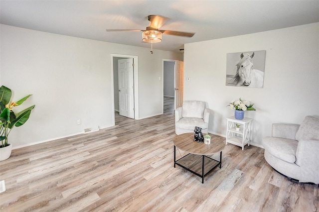 1810 N Van Buren St, Litchfield, IL 62056 - living area with wood finished floors, ceiling fan, and baseboards