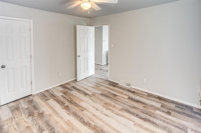 1810 N Van Buren St, Litchfield, IL 62056 - unfurnished bedroom featuring wood finished floors, baseboards, and a ceiling fan