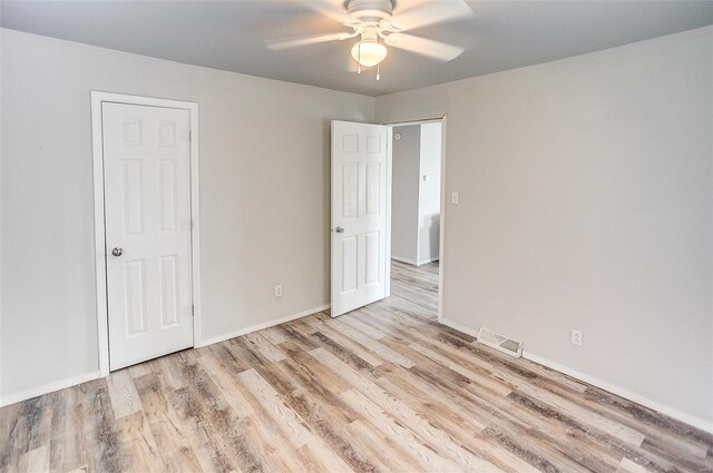 1810 N Van Buren St, Litchfield, IL 62056 - unfurnished bedroom featuring wood finished floors, baseboards, and ceiling fan