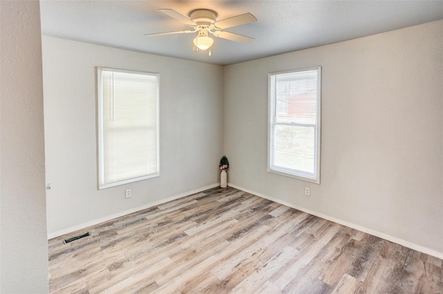 1810 N Van Buren St, Litchfield, IL 62056 - unfurnished room with wood finished floors, ceiling fan, and baseboards