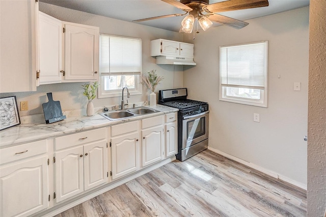 1810 N Van Buren St, Litchfield, IL 62056 - kitchen featuring gas stove, under cabinet range hood, a sink, white cabinets, and ceiling fan