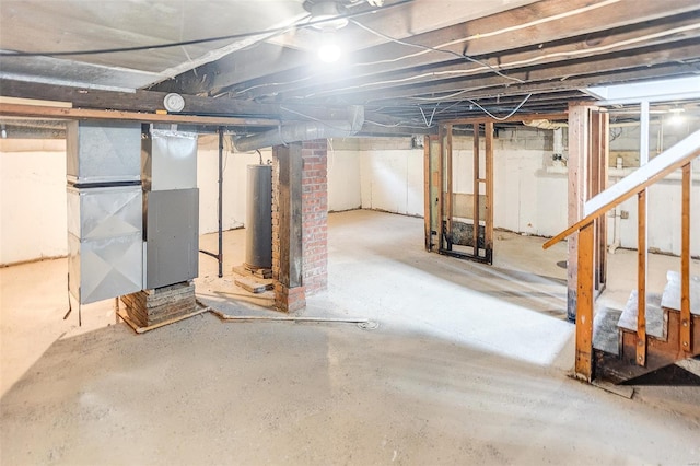 1810 N Van Buren St, Litchfield, IL 62056 - unfinished basement with heating unit, stairs, and water heater
