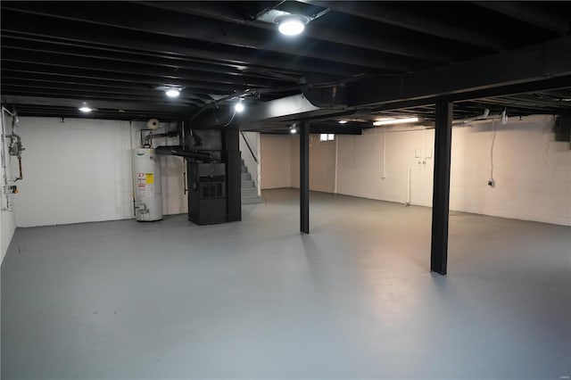 9235 Catalina Dr, Saint Louis, MO 63136 - unfinished below grade area featuring water heater, stairway, and heating unit