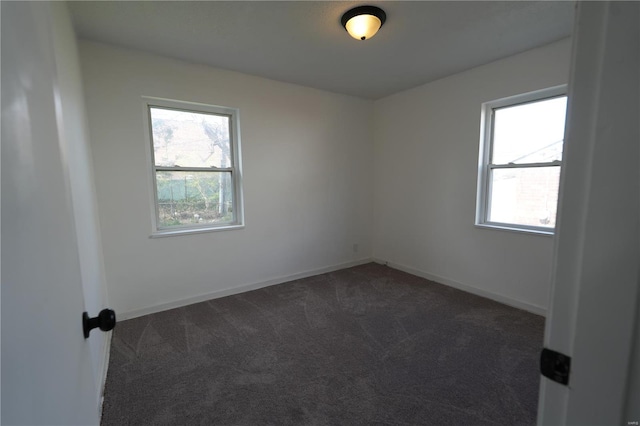 9235 Catalina Dr, Saint Louis, MO 63136 - spare room with dark colored carpet and baseboards