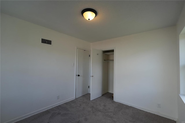 9235 Catalina Dr, Saint Louis, MO 63136 - unfurnished bedroom featuring carpet, a closet, and baseboards