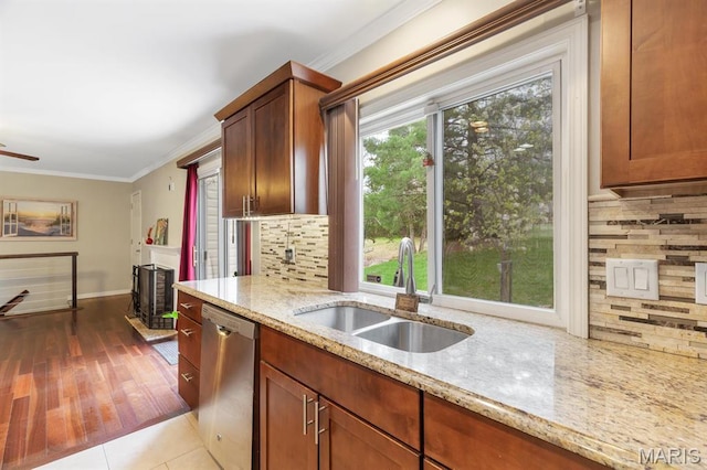269 Braeshire Dr, Ballwin, MO 63021 - kitchen featuring stainless steel dishwasher, a sink, crown molding, light stone counters, and decorative backsplash
