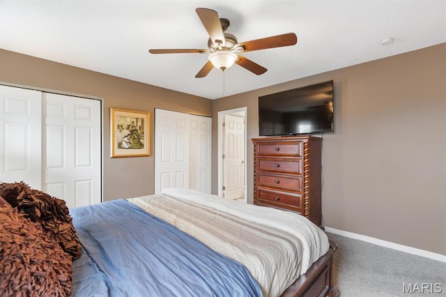 269 Braeshire Dr, Ballwin, MO 63021 - bedroom featuring two closets, baseboards, carpet floors, and a ceiling fan