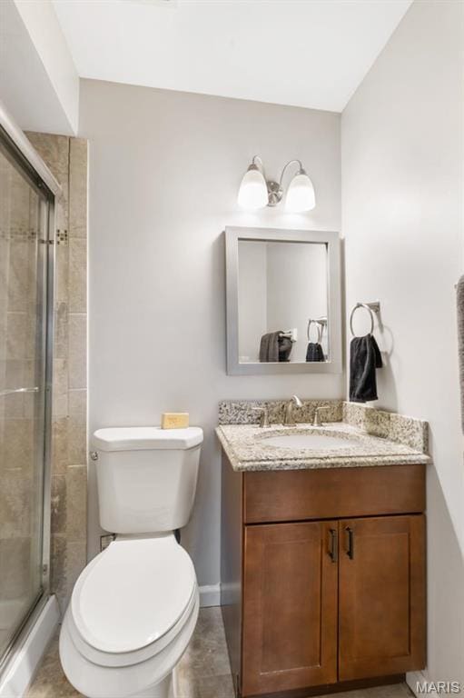 269 Braeshire Dr, Ballwin, MO 63021 - bathroom featuring vanity, a shower stall, toilet, and baseboards