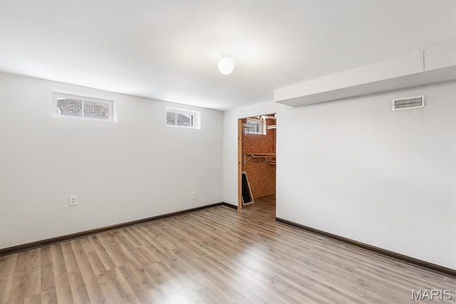 269 Braeshire Dr, Ballwin, MO 63021 - below grade area featuring baseboards and light wood-type flooring