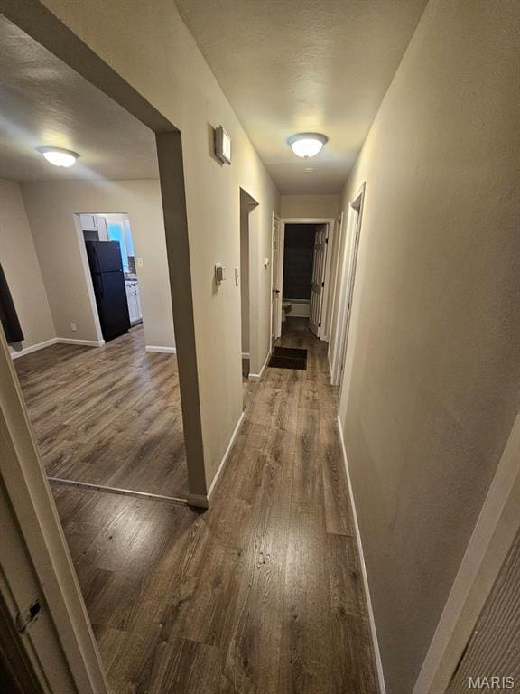 7200 Sapphire Ave, Saint Louis, MO 63136 - hallway featuring wood finished floors
