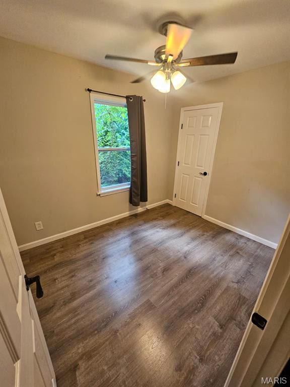 7200 Sapphire Ave, Saint Louis, MO 63136 - spare room featuring ceiling fan and dark wood-style flooring