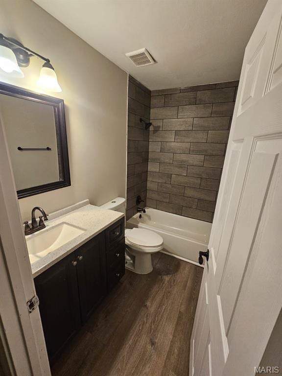 7200 Sapphire Ave, Saint Louis, MO 63136 - full bath with wood finished floors, vanity, and bathing tub / shower combination