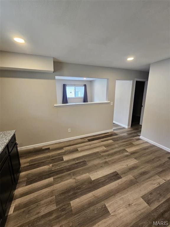 9827 Winkler Dr, Saint Louis, MO 63136 - below grade area featuring baseboards, dark wood-style flooring, and recessed lighting