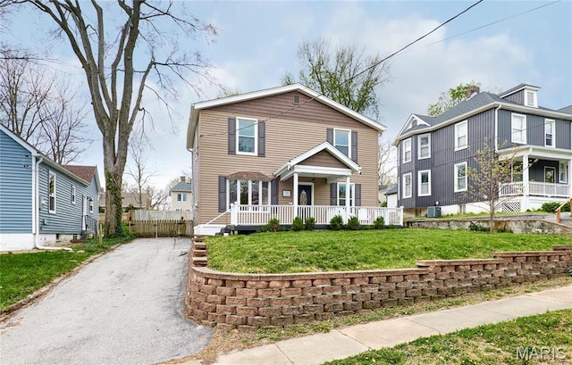 840 Marshall Ave, Saint Louis, MO 63119 - view of front of home featuring asphalt driveway and covered porch