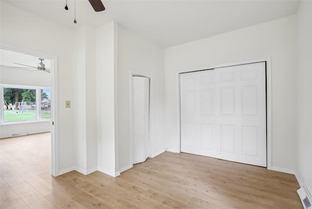 104 N 6th St, Witt, IL 62094 - unfurnished bedroom with light wood-type flooring, baseboards, and a ceiling fan