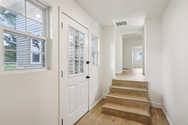 104 N 6th St, Witt, IL 62094 - entryway featuring wood finished floors, stairway, and baseboards