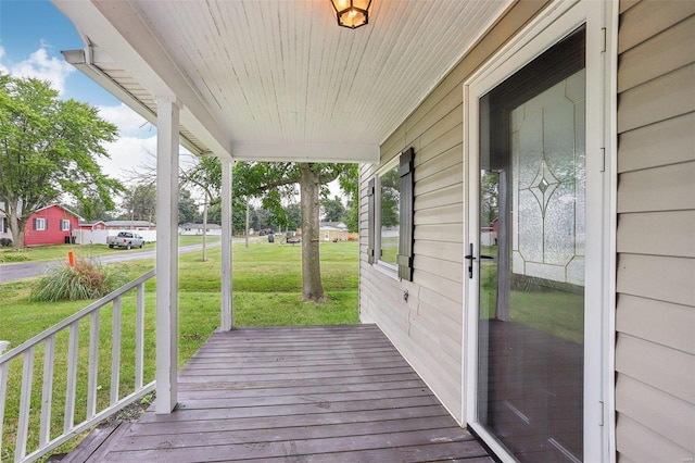 104 N 6th St, Witt, IL 62094 - wooden deck featuring a porch and a yard