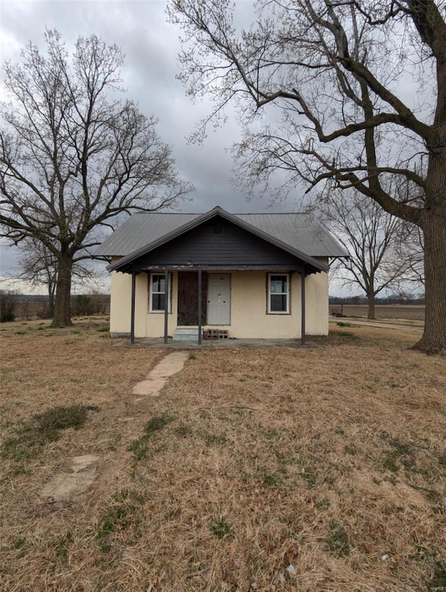 42661 State Highway Mm, Malden, MO 63863 - view of front facade with a porch, metal roof, and a front yard