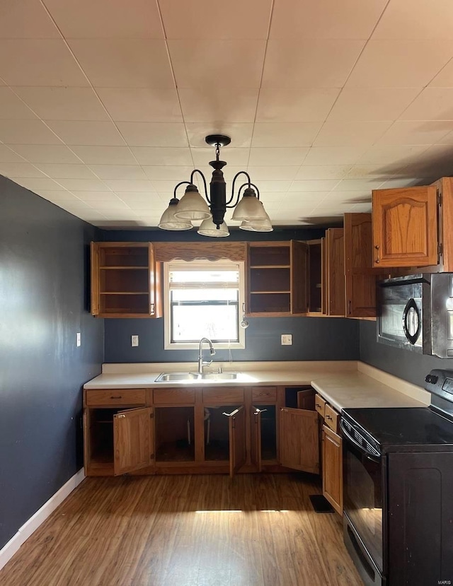 42661 State Highway Mm, Malden, MO 63863 - kitchen with black appliances, a sink, open shelves, and wood finished floors