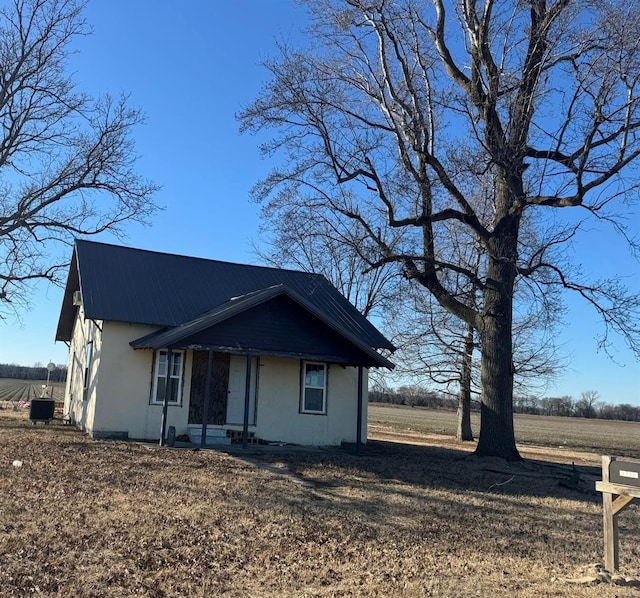 42661 State Highway Mm, Malden, MO 63863 - view of front of house with metal roof, covered porch, and stucco siding