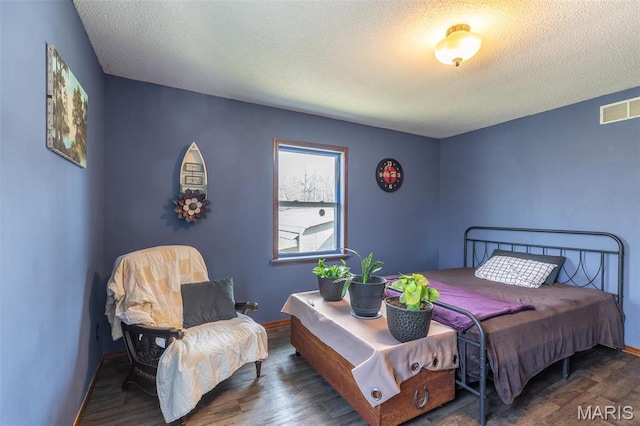 345 Johns Branch Rd, Wappapello, MO 63966 - bedroom with wood finished floors, a textured ceiling, and baseboards