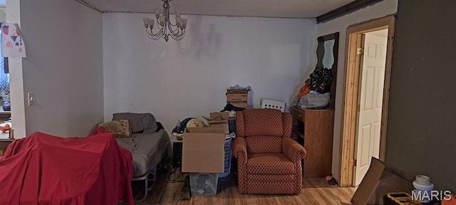 345 Johns Branch Rd, Wappapello, MO 63966 - bedroom featuring wood finished floors and a chandelier