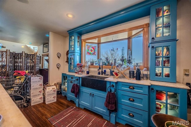 20955 Rye Ln, Richland, MO 65556 - bar featuring a sink and dark wood-type flooring