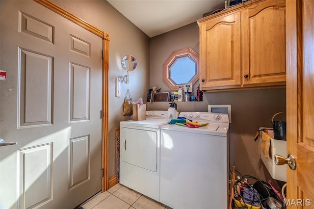20955 Rye Ln, Richland, MO 65556 - laundry room featuring separate washer and dryer, cabinet space, and light tile patterned flooring
