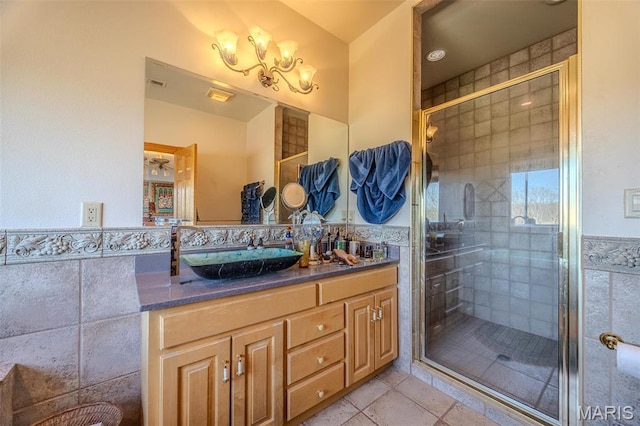 20955 Rye Ln, Richland, MO 65556 - bathroom featuring double vanity, a shower stall, and tile patterned floors