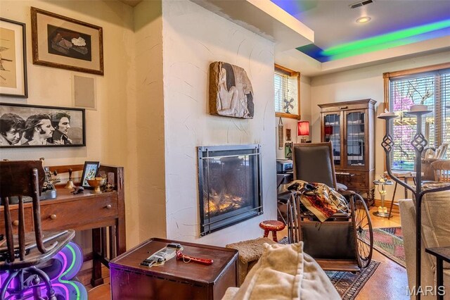 20955 Rye Ln, Richland, MO 65556 - living room featuring a high end fireplace and a raised ceiling