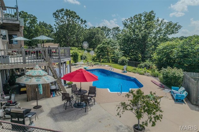 20955 Rye Ln, Richland, MO 65556 - view of swimming pool with a patio area and view of wooded area
