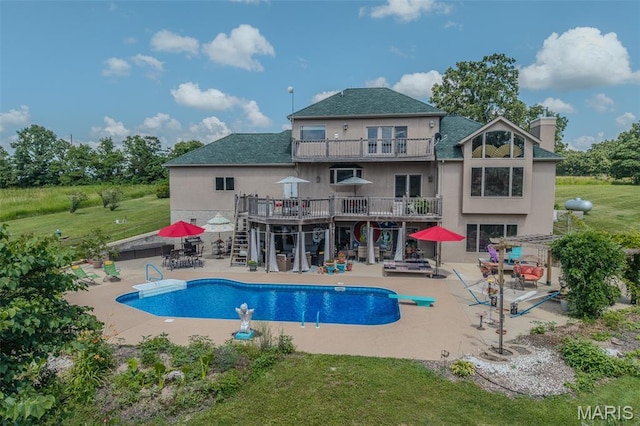 20955 Rye Ln, Richland, MO 65556 - outdoor pool featuring stairway, a patio, a wooden deck, a diving board, and a lawn