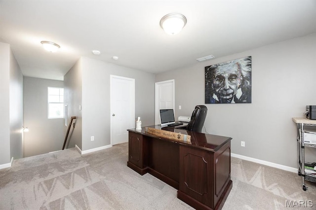 office featuring light carpet and baseboards