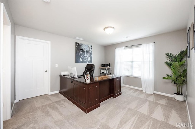 office area with light carpet and baseboards