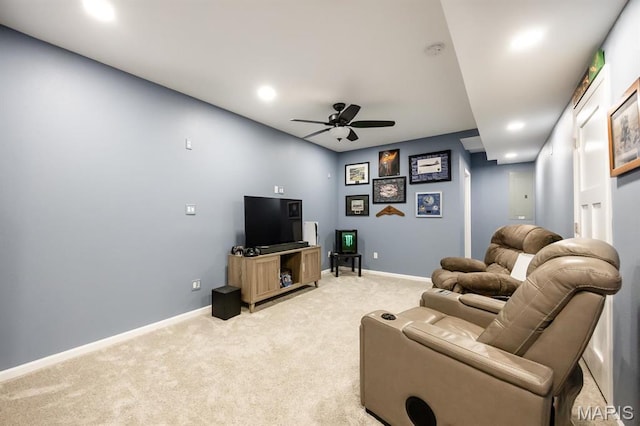 living area featuring light carpet, ceiling fan, recessed lighting, and baseboards