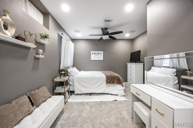 carpeted bedroom featuring a ceiling fan and recessed lighting