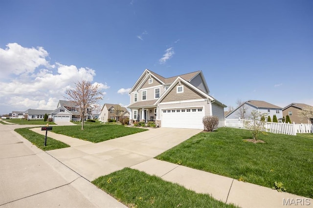 craftsman-style house featuring driveway, a garage, a residential view, and stone siding