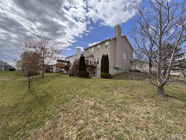 202 Reliance Rd, Foristell, MO 63385 - rear view of property with a chimney, a deck, and a lawn