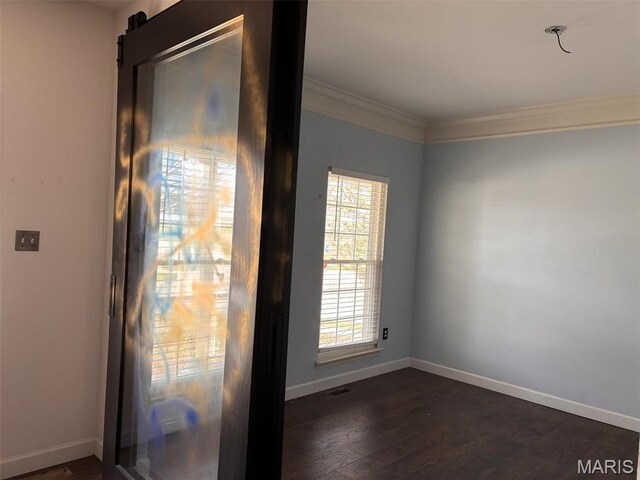 202 Reliance Rd, Foristell, MO 63385 - unfurnished room featuring healthy amount of natural light, baseboards, ornamental molding, and dark wood-style flooring