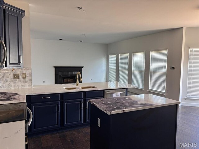 202 Reliance Rd, Foristell, MO 63385 - kitchen featuring a sink, a peninsula, dark wood-type flooring, and backsplash