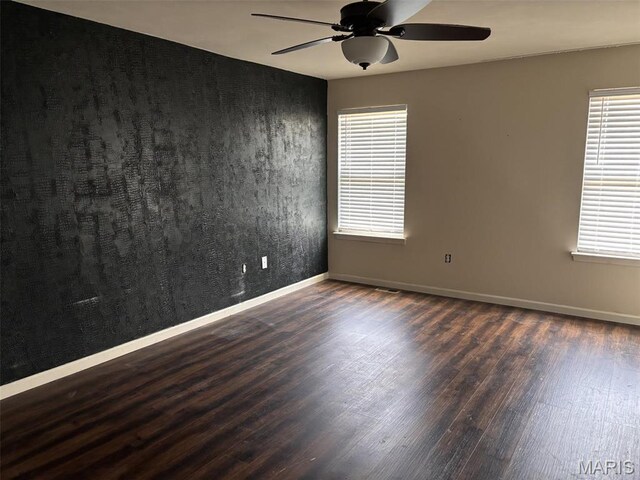 202 Reliance Rd, Foristell, MO 63385 - unfurnished room with wood finished floors, a ceiling fan, healthy amount of natural light, and baseboards
