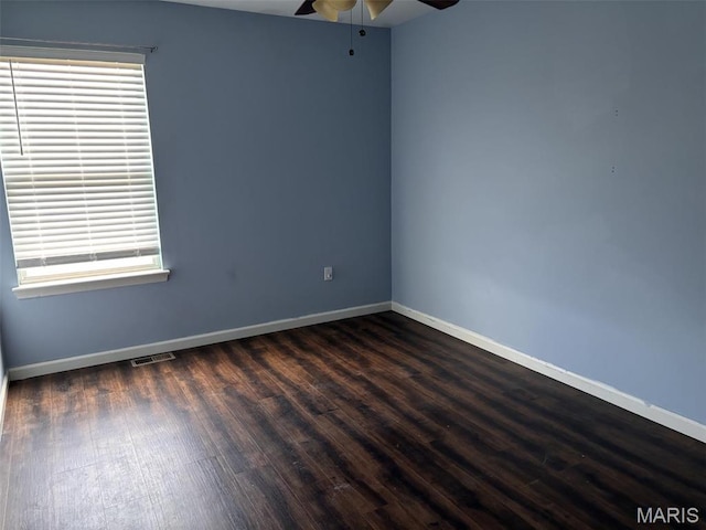 202 Reliance Rd, Foristell, MO 63385 - spare room featuring a ceiling fan, baseboards, and dark wood-style flooring
