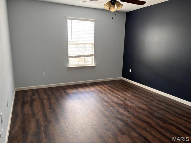 202 Reliance Rd, Foristell, MO 63385 - unfurnished room featuring a ceiling fan, dark wood-style floors, and baseboards